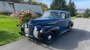 Image result for Trojan Maroon 1939 Oldsmobile