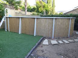 Give You Above Ground Pool A Face Lift By Wrapping It In Bamboo Backyard Pool Above Ground Pool Backyard Pool Landscaping