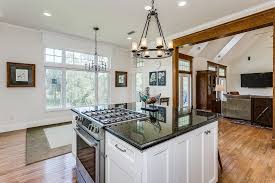 Mother cooks in the kitchen. How To Choose The Perfect Cooktop For Your Kitchen Decor Or Design