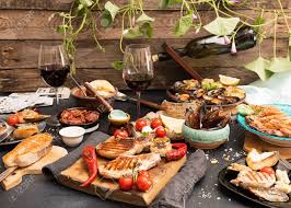 We send you personalised menus. Overhead Of Dinner Table Assorted Delicious Grilled Barbecue Stock Photo Picture And Royalty Free Image Image 86431889