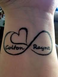 Most people like to have name tattoos on their wrist or forearm but if you love the name very much then try it on rib cage like this. The Ultimate List Of 50 Awesome Wrist Tattoos For Women Name Tattoos On Wrist Wrist Tattoos For Women Heart Tattoos With Names