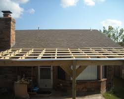 Solid patio covers will maximize the amount of shade and provide the best protection from a light rain shower. How To Build A Patio Cover With A Corrugated Metal Roof Dengarden