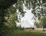 l'atelier senzu builds carousel-inspired rammed earth pavilion for ...