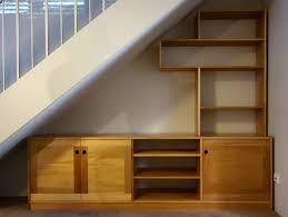Gorgeous staircase with sleek and flowing shelves underneath. Alison S Under Stair Entertainment Unit Nathaniel Grey