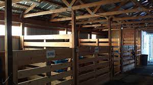 Simple horse barns provide protection from the sun, wind, rain or snow and just enough space for the barn should be sturdy enough to stand up to the weather and the horses. Homemade Box Stalls With Just 2x8 S And 4x4 S Horse Stalls Horse Barns Barn Renovation