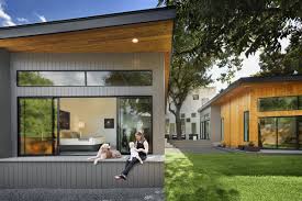 Having a courtyard in the house incorporates nature in the architecture in a beautiful way. Bold And Modern U Shaped Courtyard House Designed Around Trees