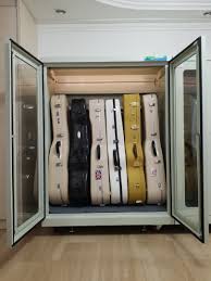 As my friend finishes building his music room (temperature controlled above the garage) he is considering hanging his electric guitars on the walls for. Dehumidifier Dry Cabinet Storage For Guitar Telescope Camera Violin Cello Airtight Automatic Humidity Controlled Electronics Others On Carousell