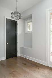 Add in some wood furnishings that have a natural stain or stripped wood look. Sherwin Williams Modern Grey Novocom Top