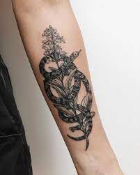 Snake Wrapped Around A Flower Tattoo Inked On The Left Forearm By Finley Jordan Around Arm Tattoo Tattoos Arm Tattoos For Women