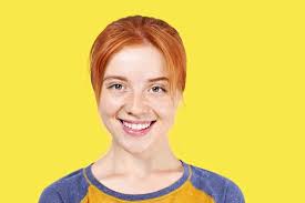 Any who tease in a less good hearted way, are then. Beautiful Redheaded Young Woman With Satisfied Facial Expression Isolated On Yellow Background Attractive Female With Natural Red Hair Brown Eyes Showing Sincere Smile Perfect Teeth Copy Space Stock Photo