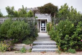 An Abundant Border Garden Of Bayberry Inkberry And Rosa Rugosa Mixed With Perennials Not Only Creates A Coastal Gardens Coastal Landscaping Garden Entrance