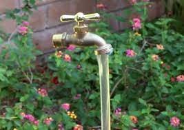 It then flows through the bucket's spigot into another pipe and finally into a washtub filled with aquatic plants. The Whoot Diy Fountain Diy Solar Fountain Diy Water Fountain