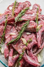 Heat 2 tbsp olive oil in a large ovenproof sauté pan over add the lamb loins and cook just until browned on each side, about three minutes. Lamb Chops With Shallots Green Pea Hummus And Fresh Thyme Leaves Served In Big Glass Tray Plate Stock Photo Image Of Plate Pesto 157512968
