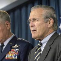The Honorable Donald H. Rumsfeld, right, U.S. Secretary of Defense,  congratulates U.S. Air Force COL. Maria Cribbs
