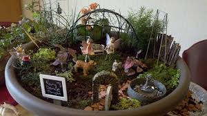 Our fairy garden is made from a simple inexpensive wooden birdhouse and natural materials. Fairy Garden Supplies At Michaels Google Search Indoor Fairy Gardens Fairy Garden Gnomes Fairy Garden Supplies