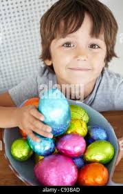 A portrait of chocolate easter eggs wrapped in tin colorful foiln standing  up
