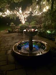 My Backyard Patio Happy Place Bistro Lights In Tree Floating Glass Balls In Fountain Tree Lighting Bistro Lights Backyard Patio