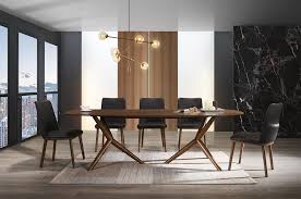 Glass tables are great for contemporary and small spaces since the transparent glass makes rooms feel lighter and more open. Modrest Utah Modern Walnut Rectangular Dining Table