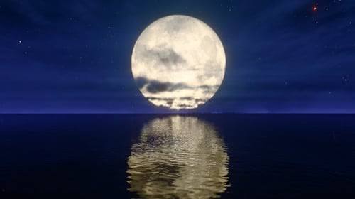 Full Moon Night Over Ocean with Reflecting Water