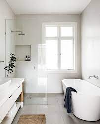 As the small bathroom above shows, adding a mirror across a whole wall can double the look and feel of let's be honest, no one likes shower curtains. 15 Small Bathrooms That Are Big On Style Small Bathroom Remodel Bathroom Layout Luxury Bathroom