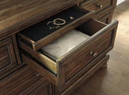 The set is crafted from acacia veneers, engineered board, and hardwood solids with an attractive medium brown finish. Flynnter 4pc Panel Bedroom Set In Medium Brown