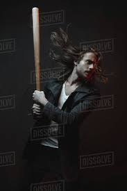 What's the best size for a baseball bat? Young Long Haired Man Holding Baseball Bat Ready To Hit In Darkness Stock Photo Dissolve