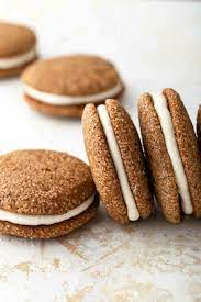 Soft And Chewy Pumpkin Molasses Cookies Sandwiched Together With A Sweet And Tangy Cream Chees Sandwich Cookies Sandwich Cookies Christmas Cream Cheese Cookies