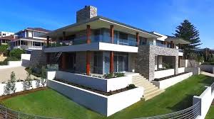 House exterior with sunloungers on patio. Modern House Design Interior Exterior Pictures Designing Idea
