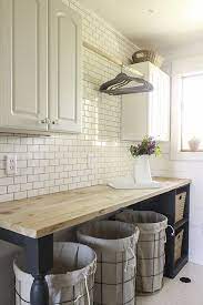 A bench goes well at a table where you'll expect the whole family to sit for meals. 55 Rustic Laundry Room Home Decor Ideas Laundry Room Rustic Laundry Rooms Laundry Room Decor