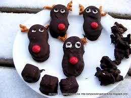 Place a small amount of peanut butter on the top of a nutter butter cookie and then put a small pretzel twist on the peanut. Amy S Cooking Adventures Nutter Butter Reindeer And Reindeer Poop