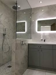 The glow is soft, golden and comforting. Just Bathrooms Ltd On Twitter This Stunning En Suite Was Designed With A Selection Of Classic Wall And Floor Tiles That With The Help Of The Glazed Finish Brings So Much Light