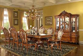 This dining room manages to be at once elegant and approachable, combining a friendly mix of details like its red brick fireplace, casual rug and refined upholstered dining chairs. Traditional Formal Dining Room Set Homey Design Shipping Bedroom Atmosphere Ideas Rustic Luxury Antique Elegant Furniture Rooms Transitional Apppie Org