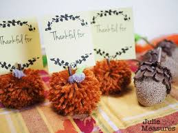 I found these adorable little pumpkin vase fillers on clearance at michael's and thought they'd be perfect! Pumpkin Pom Pom Thanksgiving Name Cards Julie Measures