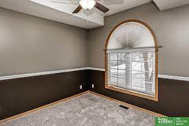 The painting is done and having trouble with the chair rail. How To Fix Our Dark Brown Wall Paint Chair Rail Cream And Then Taupe On Top