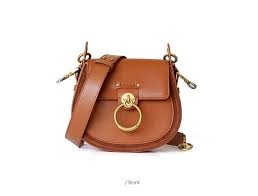 genuine leather crossbody women bag genuine leather suede saddle bag luxury design shoulder bags logo embossed flower in 2021 purses crossbody leather saddle bags crossbody bag