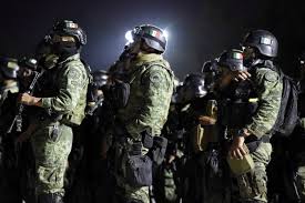 Joaquin 'el chapo' guzman is escorted by soldiers during a presentation in mexico city in 2016. Police Officer Involved In Operation Against El Chapo S Son Shot At More Than 150 Times In Daylight Assassination