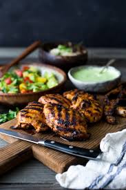 Butterflied and hot from the grill, laid out on a platter with grilled lemons and a bowl of herb sauce. Grilled Peruvian Chicken With Green Sauce Feasting At Home