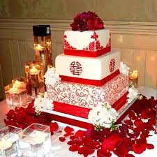 Mad hatter style wedding cake in an underwater scene decorated with two kissing seahorses made 3 tier gravity defying wedding cake with profiteroles and chocolate. Red Chinese Medallion Wedding Cake Wedding Cake Red Wooden Cake Topper Wedding Themed Wedding Cakes