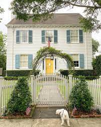White house blue shutters yellow door. Robin S Egg Blue Shutters And A Yellow Door Could This Home Be Any Cheerier Mdlab On Inst House Paint Exterior Exterior House Colors Cottage Exterior
