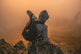 Hd Wallpaper Man In Gray Hoodie Sitting On Mountain During Daytime Person Standing On Rock Formation With Fog Weather Wallpaper Flare