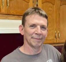 What insulation should be used to keep a shipping container storage unit  above freezing?