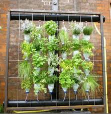 Wall Mounted Vertical Garden With Self Watering Rain Gutter System Happy House And Garden Social Site Bottle Garden Hanging Garden Vertical Herb Garden
