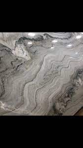 The soft gray background is subtly highlighted with white and gray veins in these stunning quartzite slabs. Fantasy Macaubas Quartzite Msi Spa Like Bathroom Macaubas Quartzite Macaubas