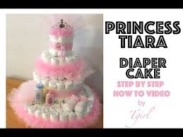 There is also a written cake tutorial for those that don't like to watch videos. How To Make A Diaper Cake Princess Tiara With Pink Feather Boa Youtube Baby Shower Wreath Diaper Cake Best Baby Shower Gifts