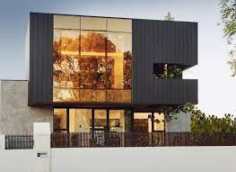Maybe you would like to learn more about one of these? A Dark Grey Color Palette Is Consistently Found Inside And Outside This Modern House