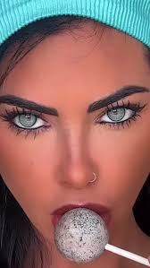 Close-Up Portrait of a Woman with Unique Lollipop