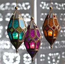 Moroccan Hanging Lantern Boho Candle Hanging Lanterns Glass Lantern The holder takes both pillar candles and tea lights, which stand on a stainless steel disc with a flexible silicone base that catches the wax, preventing it from escaping.