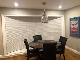 This barn door window treatment plays off the current barn door trend in home decor. Bay Bow Corner Windows Bay Window Milton Blinds