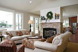 This living room offers a white fireplace lighted by wall sconces and dark wood sofa tables filled with books and candles. 100 Fireplace Design Ideas For A Warm Home During Winter