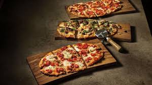 Try this recipe, you'll love it and it hits the mark: Panera Bread Introducing New Flatbread Pizzas